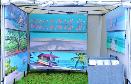 art show booth displaying photography on canvas prints